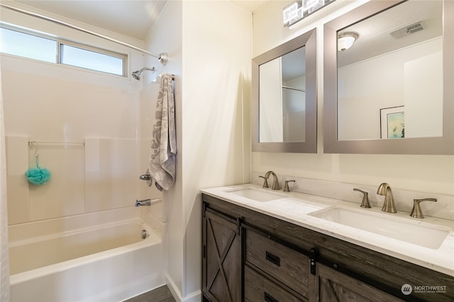 bathroom with shower / bathtub combination and vanity