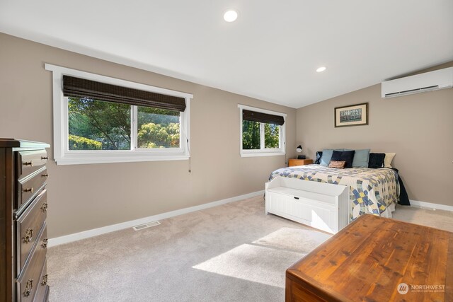 carpeted bedroom featuring lofted ceiling and a wall mounted AC