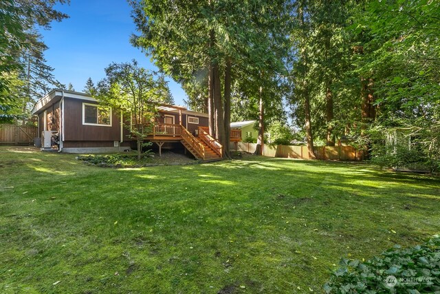 view of yard with a wooden deck