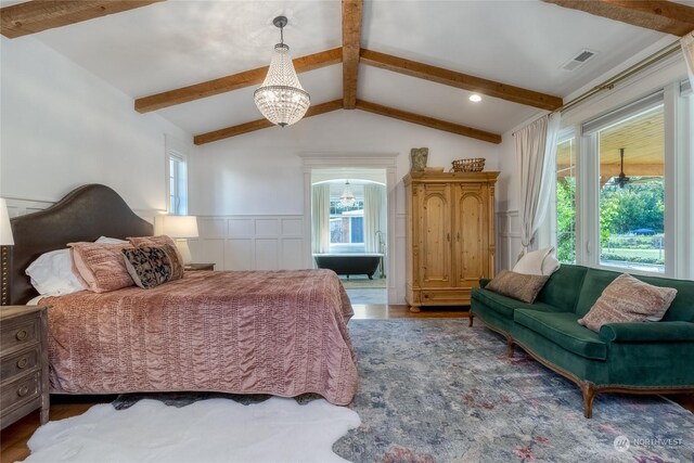 1145 School Ave, Walla Walla, WA 99362 - bedroom featuring a chandelier, a wainscoted wall, a decorative wall, and wood finished floors
