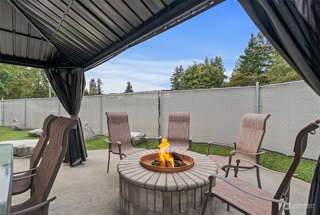 view of patio / terrace featuring an outdoor fire pit