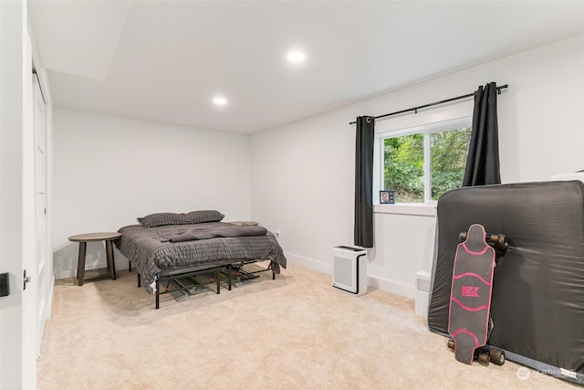 bedroom featuring light carpet