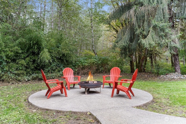 view of patio / terrace with an outdoor fire pit