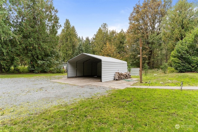 garage with a lawn and a carport