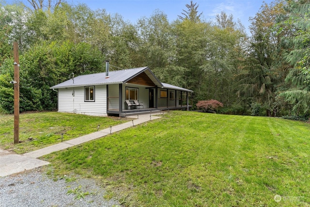 view of front of home featuring a porch and a front yard