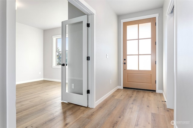 entryway with light hardwood / wood-style floors