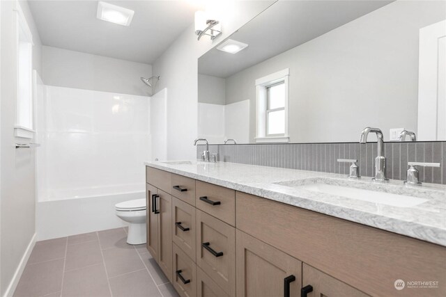 full bathroom with tile patterned flooring, shower / tub combination, vanity, and toilet