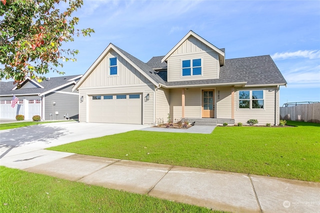 view of front of home with a front yard and a garage