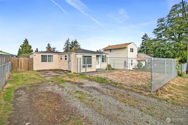 rear view of property featuring a patio area