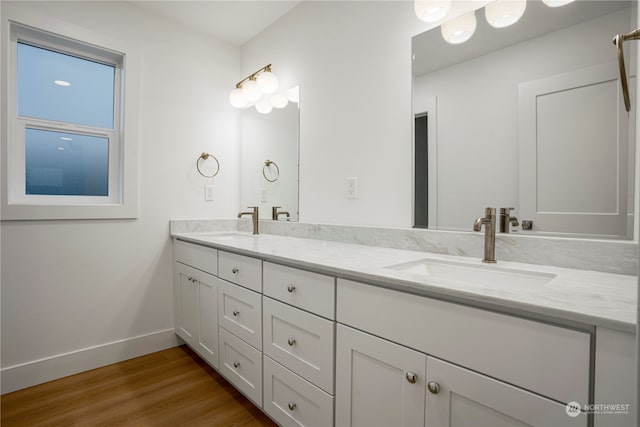 bathroom featuring hardwood / wood-style floors and vanity