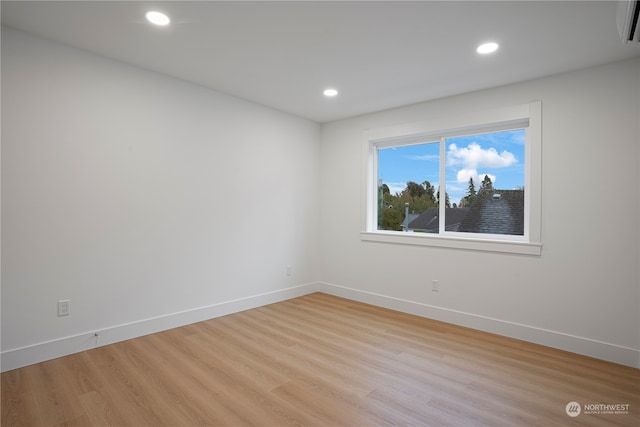 spare room featuring light wood-type flooring