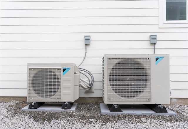 details featuring ac unit and wood walls