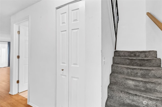 stairway featuring hardwood / wood-style flooring