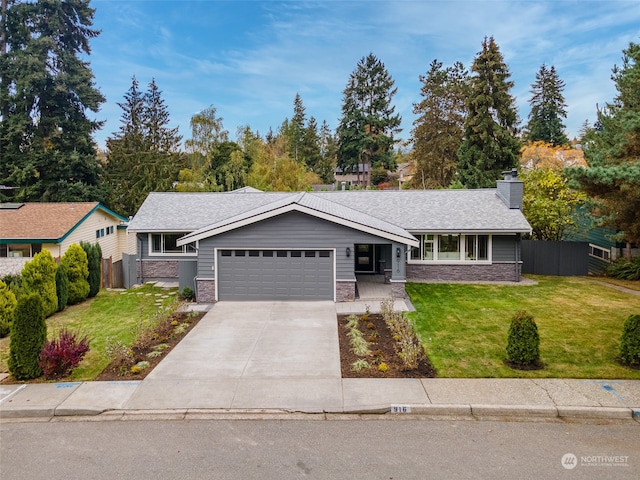 single story home featuring a garage and a front lawn