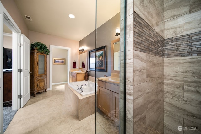 9225 Red Cliff Dr NW Unit B53, Quincy, WA 98848 - bathroom with two vanities, a garden tub, tile patterned flooring, visible vents, and a sink