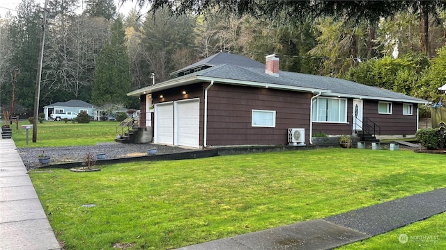 view of side of property featuring a yard and ac unit