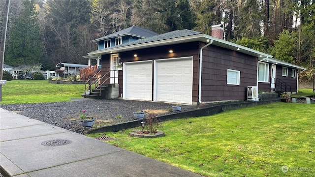 garage featuring a yard