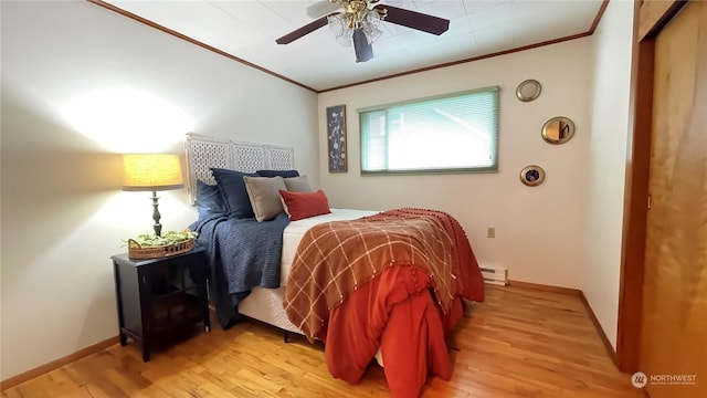 bedroom with baseboard heating, ceiling fan, light hardwood / wood-style floors, and ornamental molding