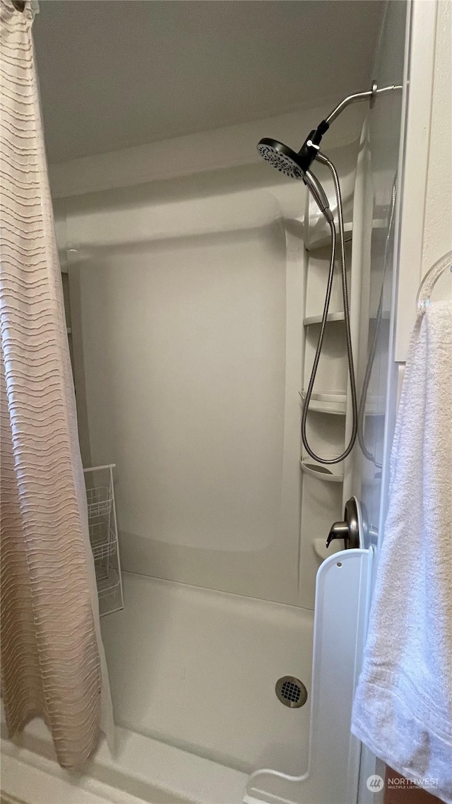 bathroom featuring a shower with curtain