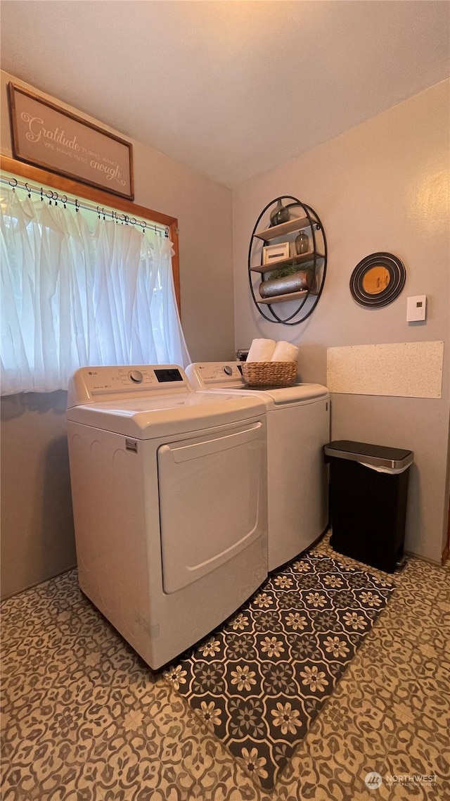 clothes washing area featuring washing machine and clothes dryer