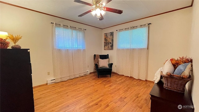 living area with crown molding, light hardwood / wood-style flooring, and plenty of natural light