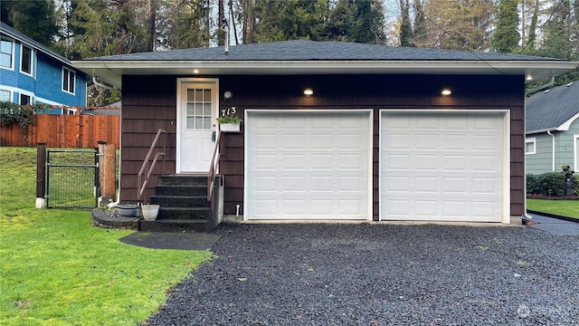 garage featuring a lawn