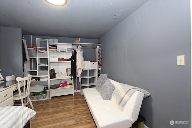 spacious closet featuring hardwood / wood-style floors