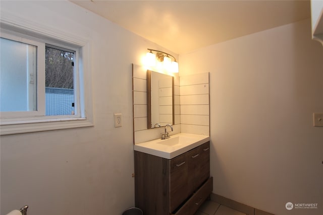 bathroom with tile patterned floors and vanity