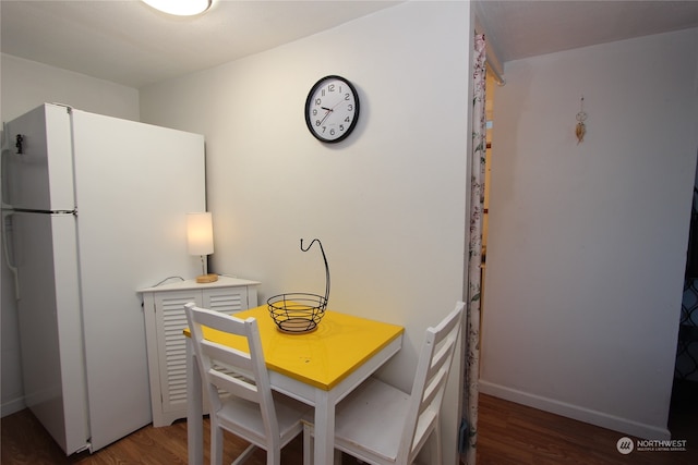 dining room featuring dark wood-type flooring