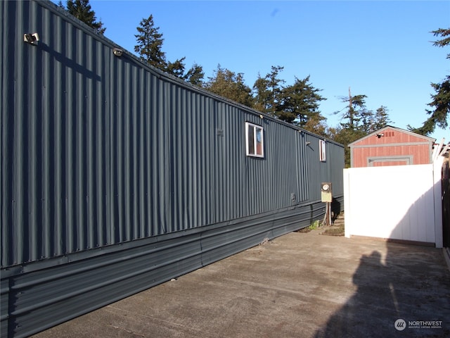 view of side of property featuring a patio