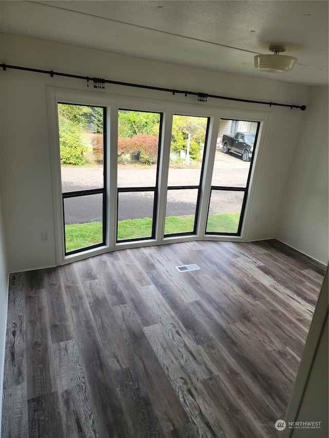 empty room with wood-type flooring