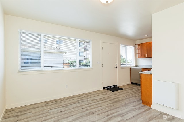 kitchen with dishwasher and light hardwood / wood-style floors