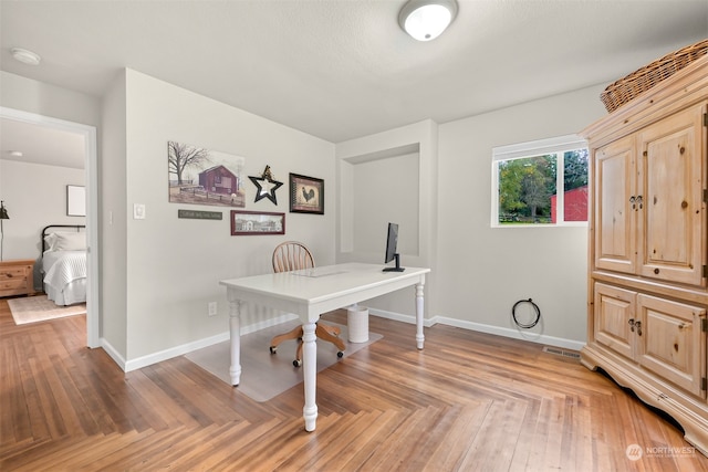 office area with parquet floors