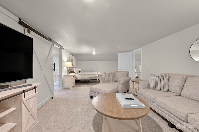 living room with light carpet and a barn door