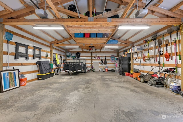 garage with black refrigerator