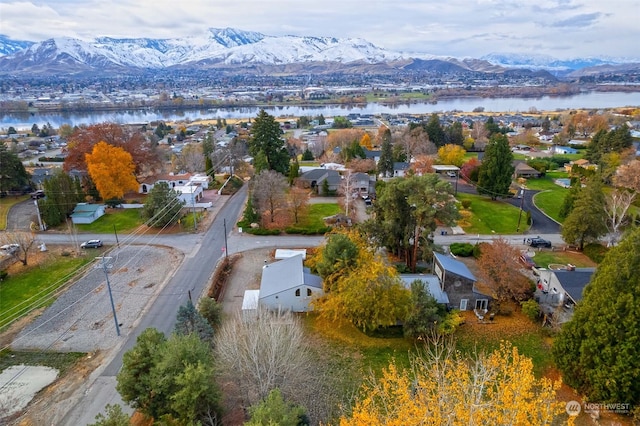 birds eye view of property featuring a water and mountain view