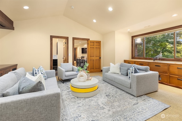 carpeted living room with vaulted ceiling