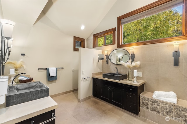 bathroom featuring vaulted ceiling, vanity, and tile patterned floors