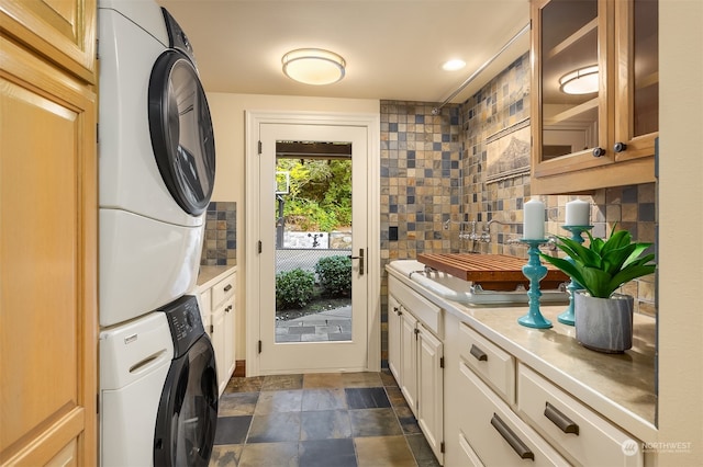 laundry room featuring stacked washer and dryer