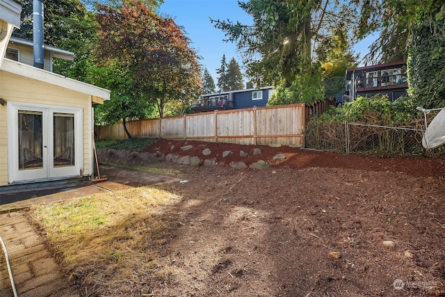 view of yard featuring french doors