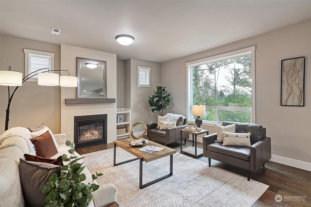 living room featuring hardwood / wood-style floors and a fireplace