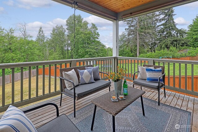 wooden terrace with a yard