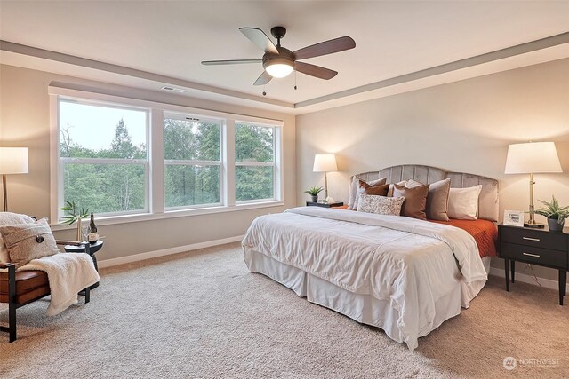 bedroom with light carpet and ceiling fan