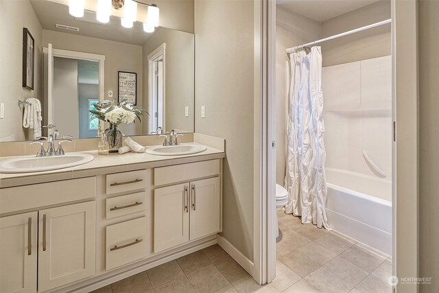 full bathroom featuring shower / tub combo with curtain, vanity, toilet, and tile patterned flooring