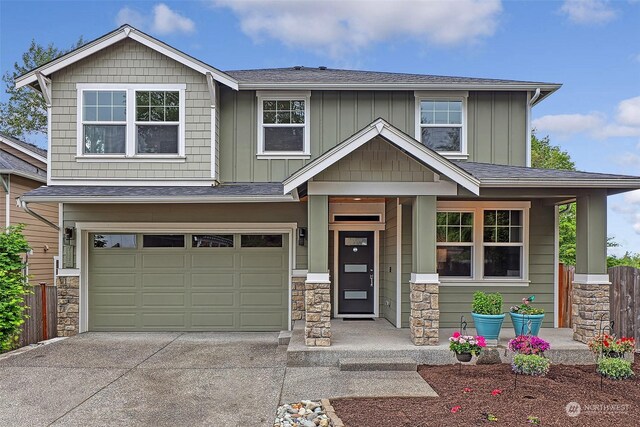 craftsman-style home with a garage