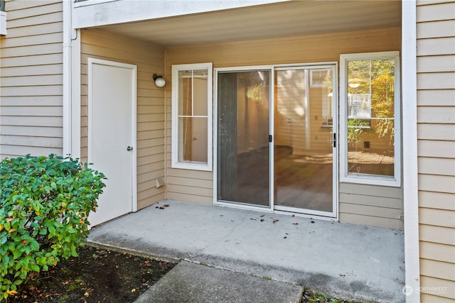 property entrance with a patio