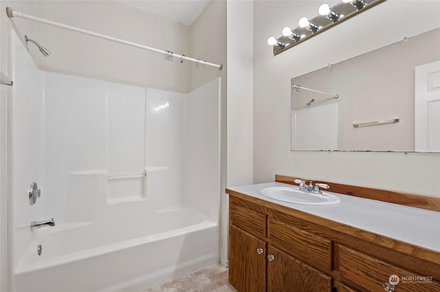 bathroom with shower / bathing tub combination and vanity