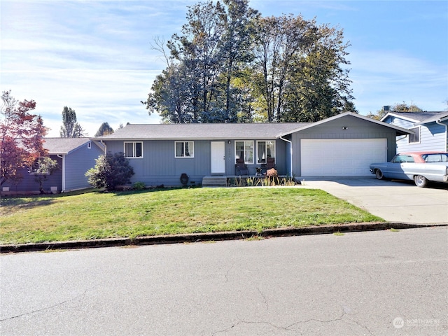 ranch-style house featuring a front lawn and a garage