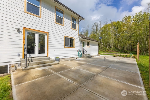 rear view of property featuring a patio area