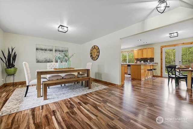 dining space with french doors and dark hardwood / wood-style flooring